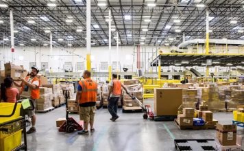 While businesses are suffering, Amazon looks to hire 100k workers to help with increased online orders amazon warehouse